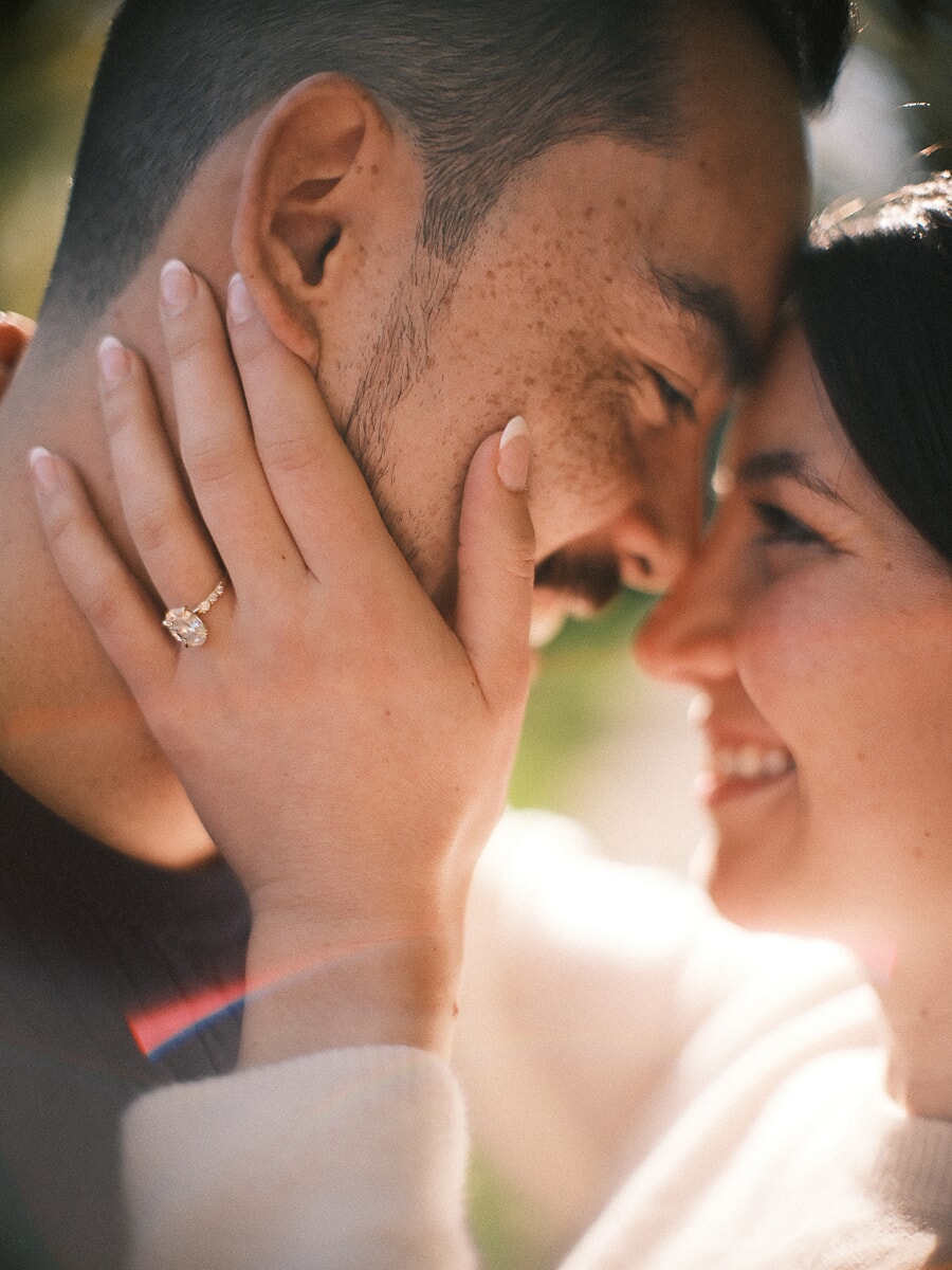 Proposal SP17 Sensual close-up of a couple touching foreheads as the bride-to-be's hand and engagement ring frame her fiancé's face